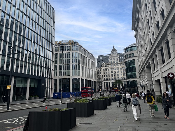 Pedestrianised street lined with modern buildings near London Bridge