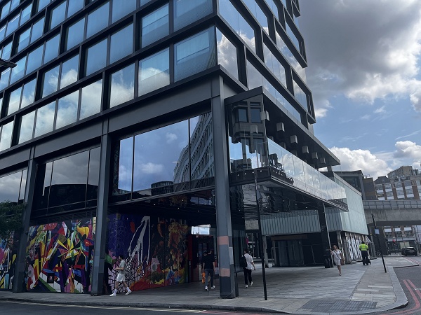 A contemporary office building with street art